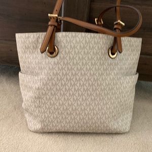 Micheal Kors white and brown hand bag.